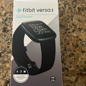 Fitbit Versa 2 unopened. Extra bands, charger, and screen protector included.